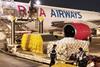 Raya Airways freighter being unloaded by Hactl at Hong Kong