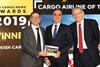 Turkish Cargo's Fatih Cigal collects the award from Ross Marino of sponsor dnata and event host Simon Calder