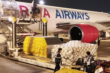 Raya Airways freighter being unloaded by Hactl at Hong Kong