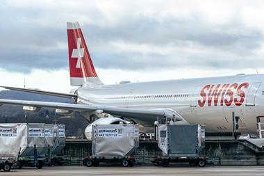 Swiss aircraft Being loaded with cargo