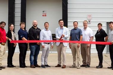 Avflight and Lufthansa team members cutting a ribbon at the Nomads building. Photo: Lufthansa Cargo