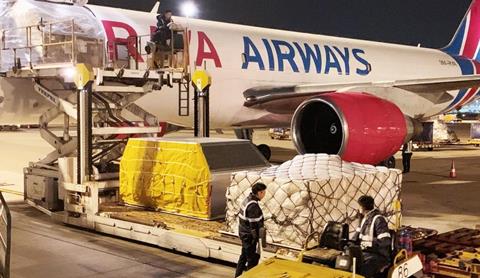 Raya Airways freighter being unloaded by Hactl at Hong Kong