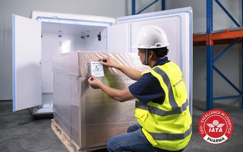 KN employee labelling a package for cooling