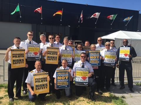 Atlas pilots protest at a shareholder meeting of customer Amazon in May 2019