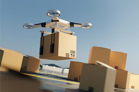 A,Drone,Lifting,Off,The,Ground,Carrying,A,Large,Parcel.