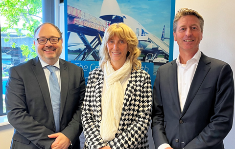 Florent Turlier, Patricia Heilbrink and Sander van Vilsteren in Front of a NAS Banner