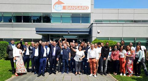 Simon Pinto and James Gagne with members of the Bansard International team at the companys headquarters in Paris