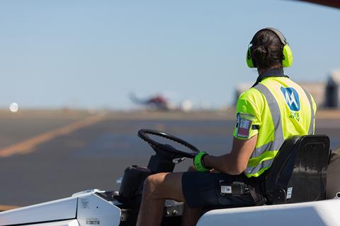 Menzies Aviation hi-viz man on tractor 1024